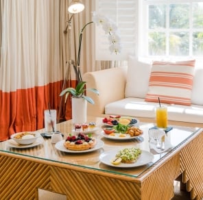 breakfast spread inside a hotel suite