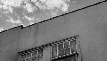 building and sky in b/w