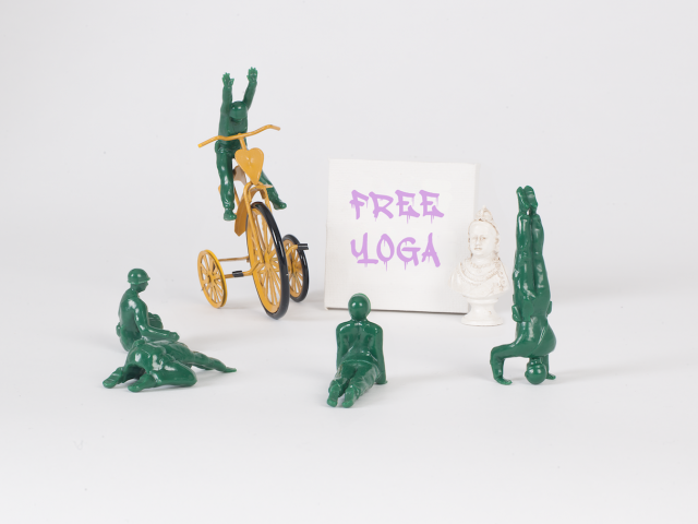 military green men toys with a free yoga sign