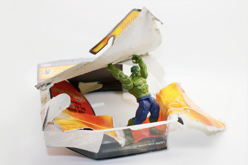 the hulk toy emerging from his packaging 