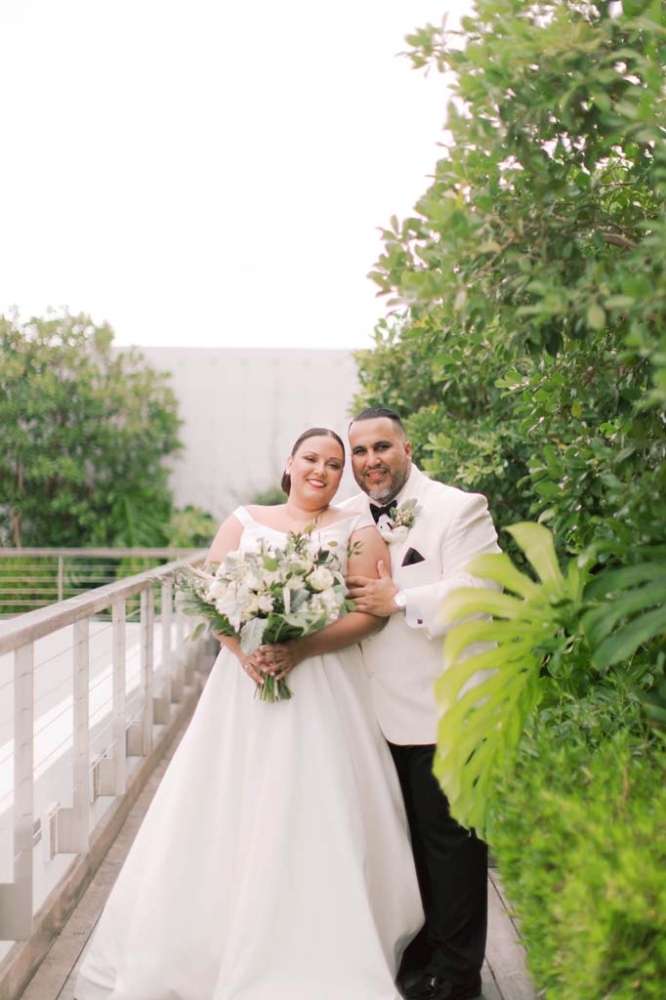 bride and groom posing for a photo
