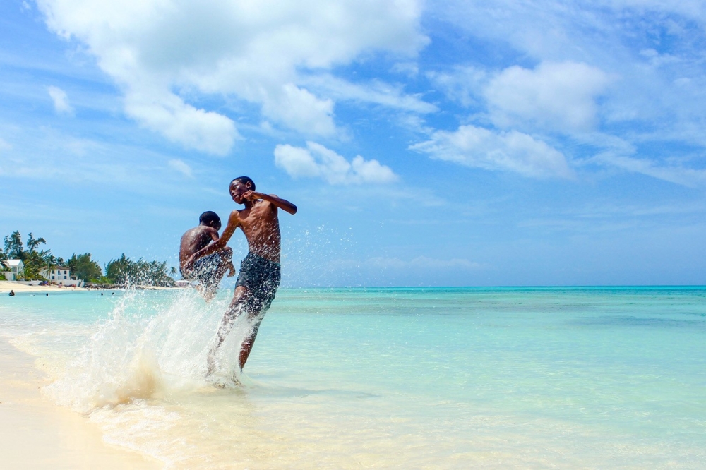 teo boys playing in the water