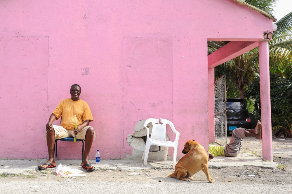 man sitting with dog 