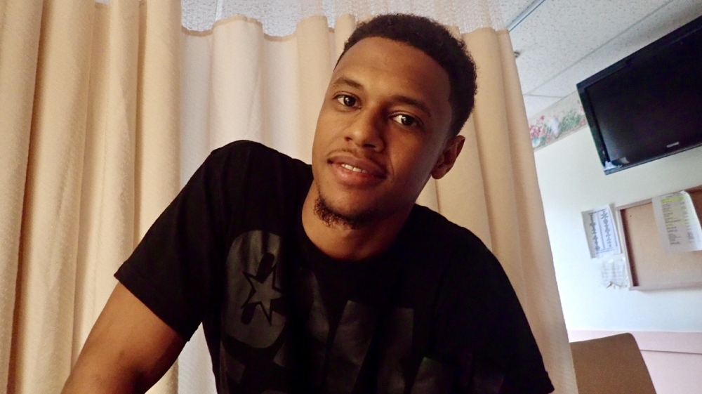 man in hospital room