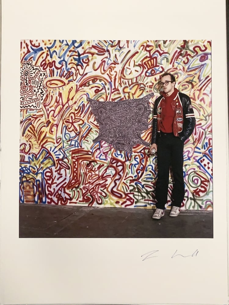 keith haring standing in front of art