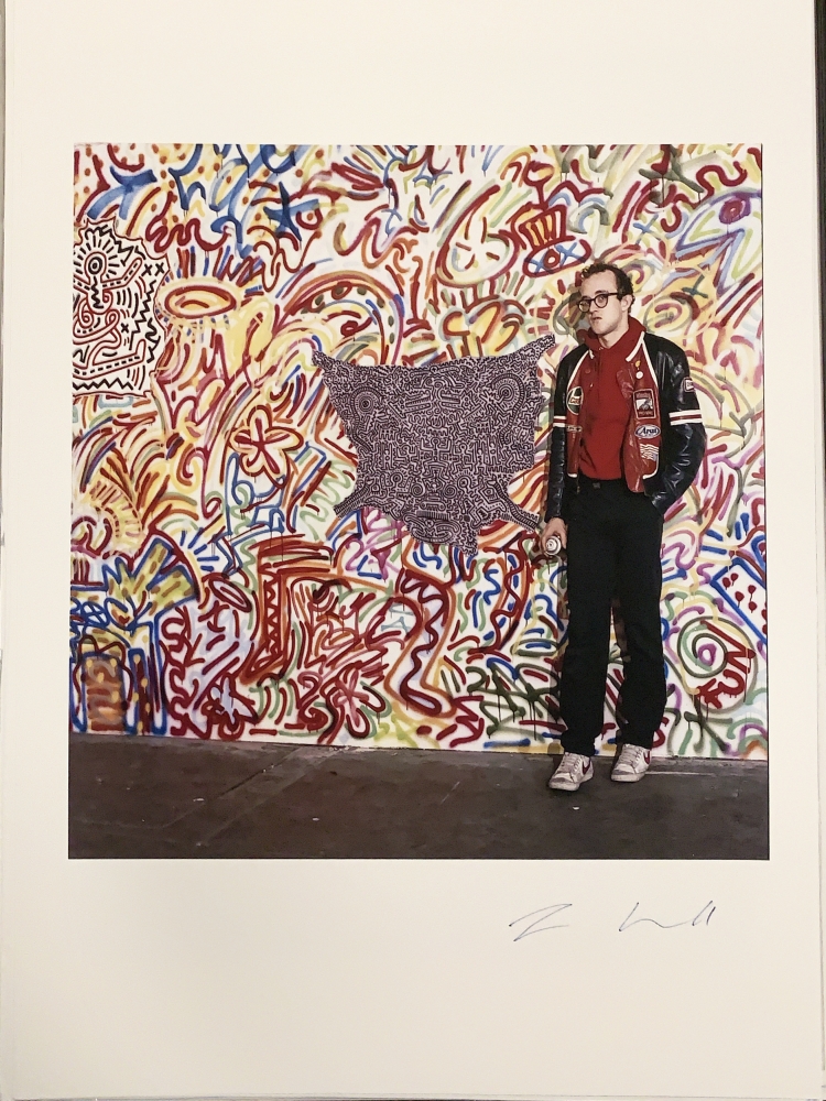 keith haring standing in front of art