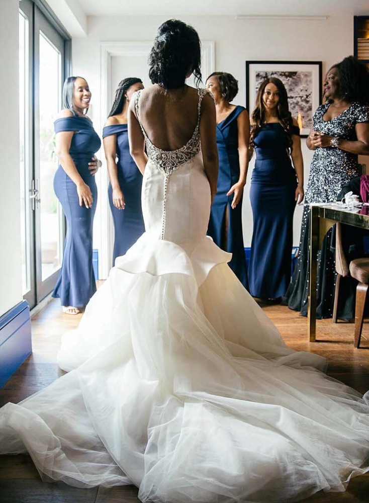 bride standing with bridesmaids 