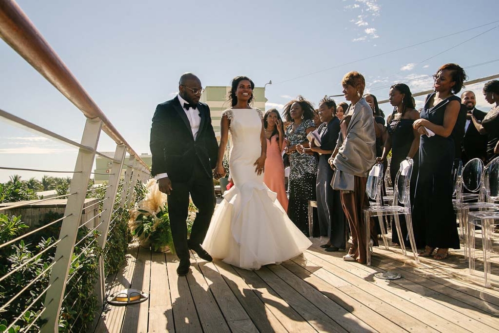 bride and groom walking down the isle
