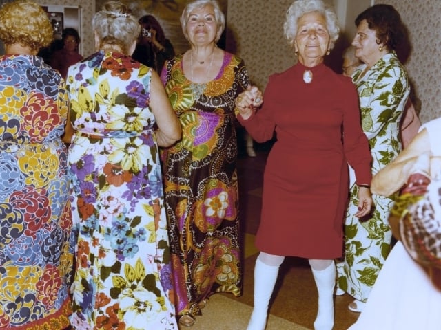 women dancing wearing dresses
