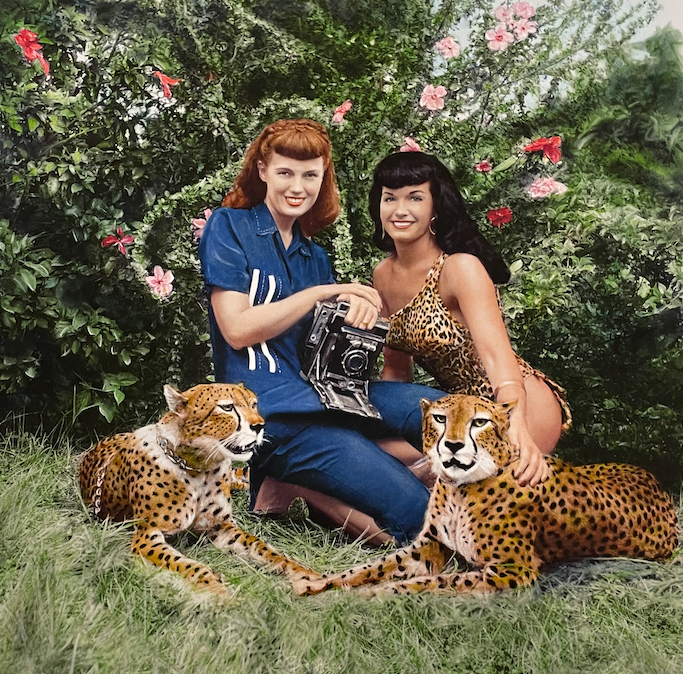 two women with two leopards