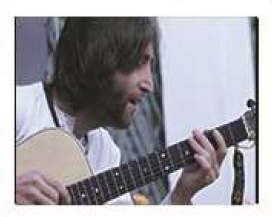 john playing guitar