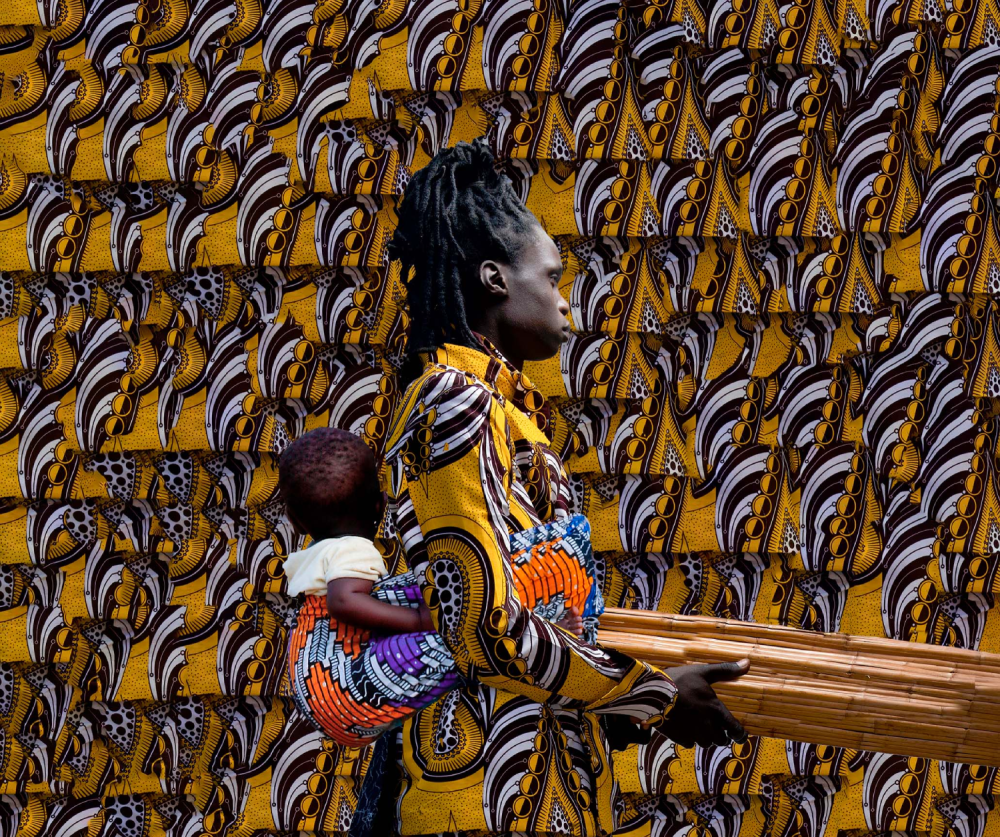 tamary photograph of a guardian carrying a child