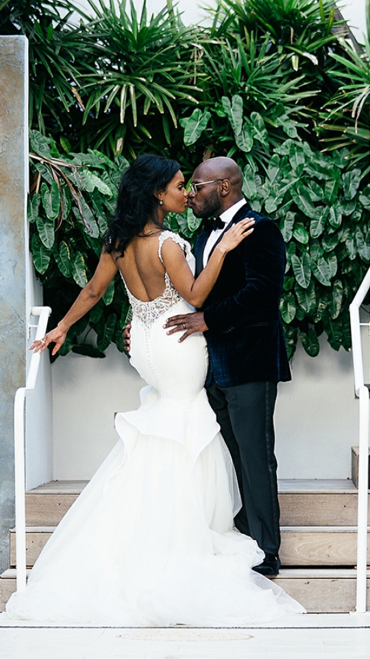 a just married couple kissing