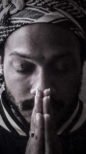 up close image of a man praying