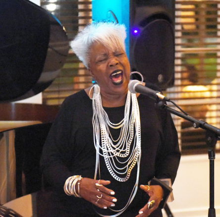 woman singing sitting down