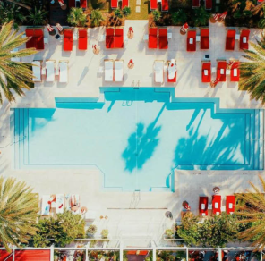 overhead view of a pool and surrounding lounge area