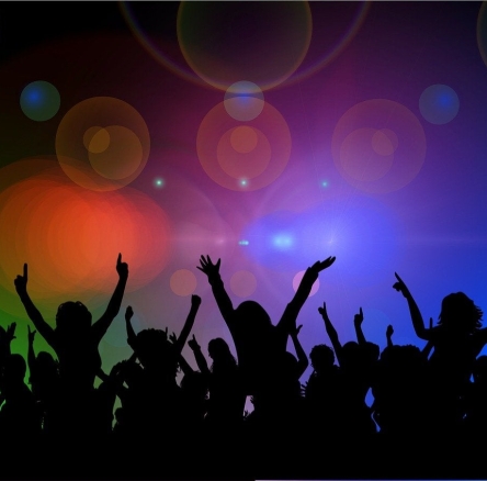 people dancing with a lot of different lights