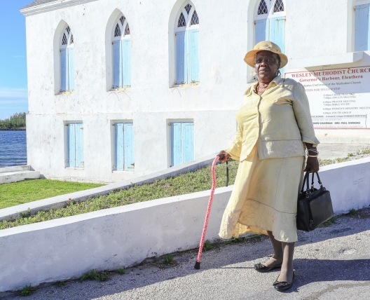 woman going to church with cane
