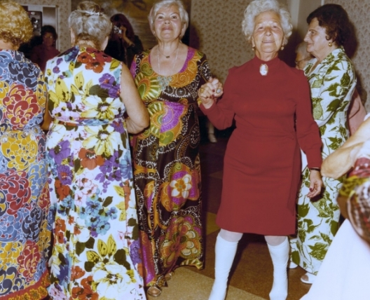 women dancing wearing dresses
