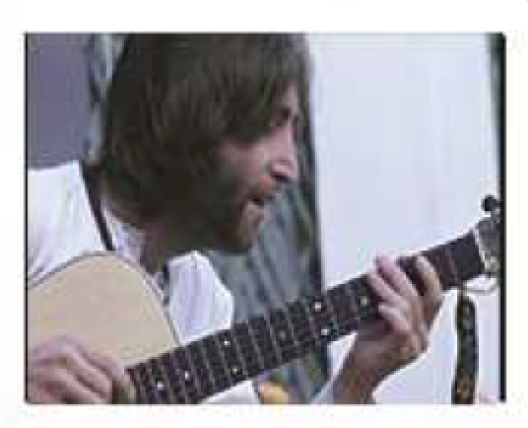john playing guitar