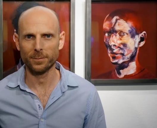 Michel Platnic Headshot with self portrait